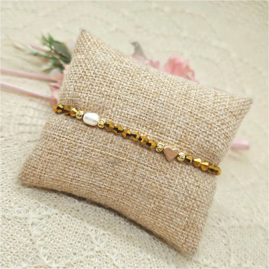 Elastisches Armband gold mit Herz und Süßwasserperle Anmarii